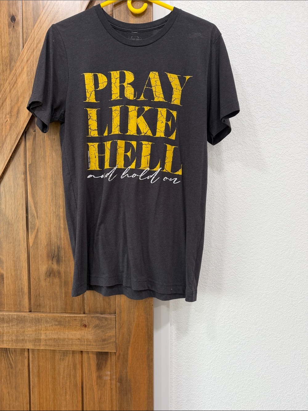 Graphic Tee with Yellow 'Pray Like Hell' Script